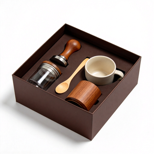 Coffee accessory collection in a dark fitted box on white background